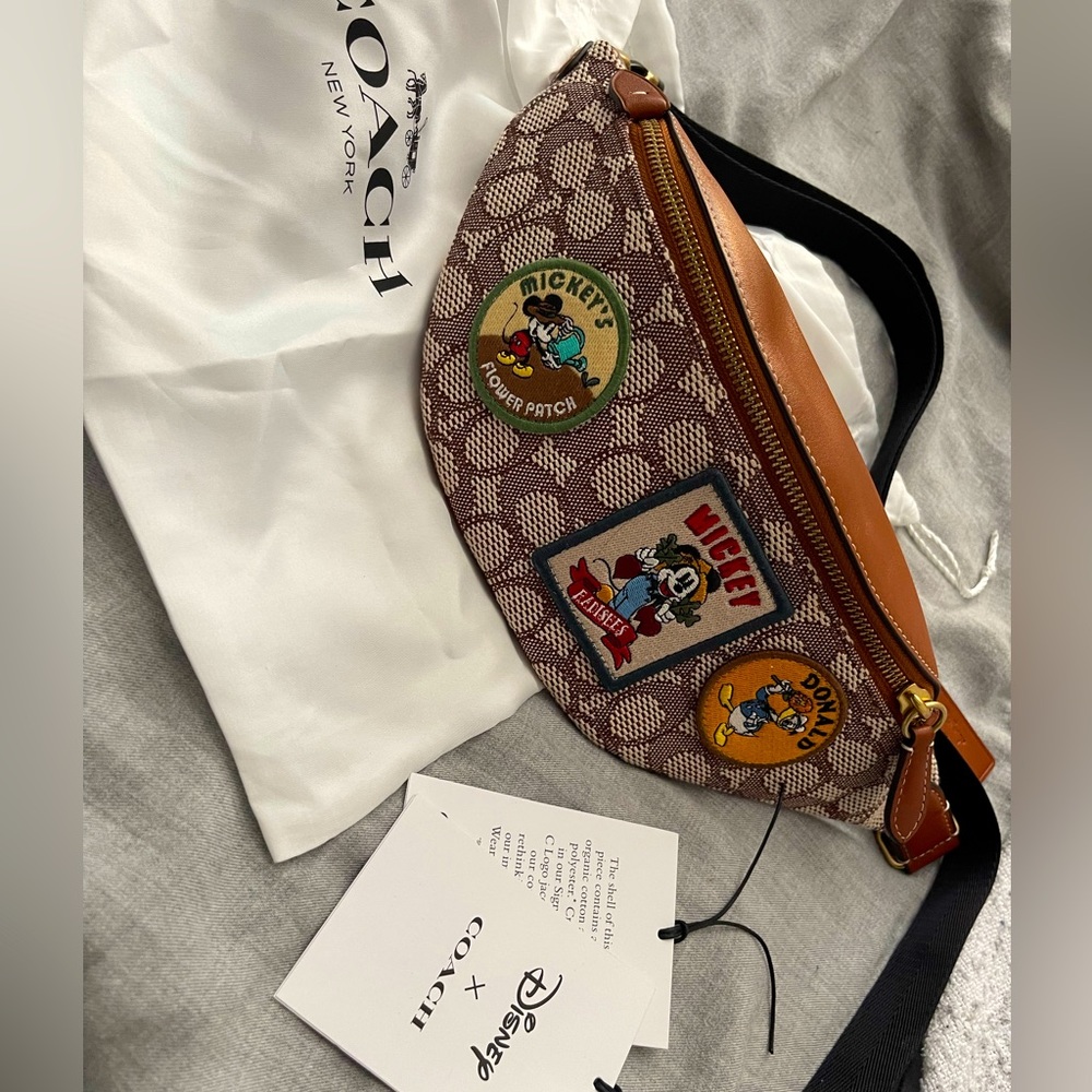 Disney X Coach Charter Belt Bag
7 In Signature Textile Jacquard
With Patches